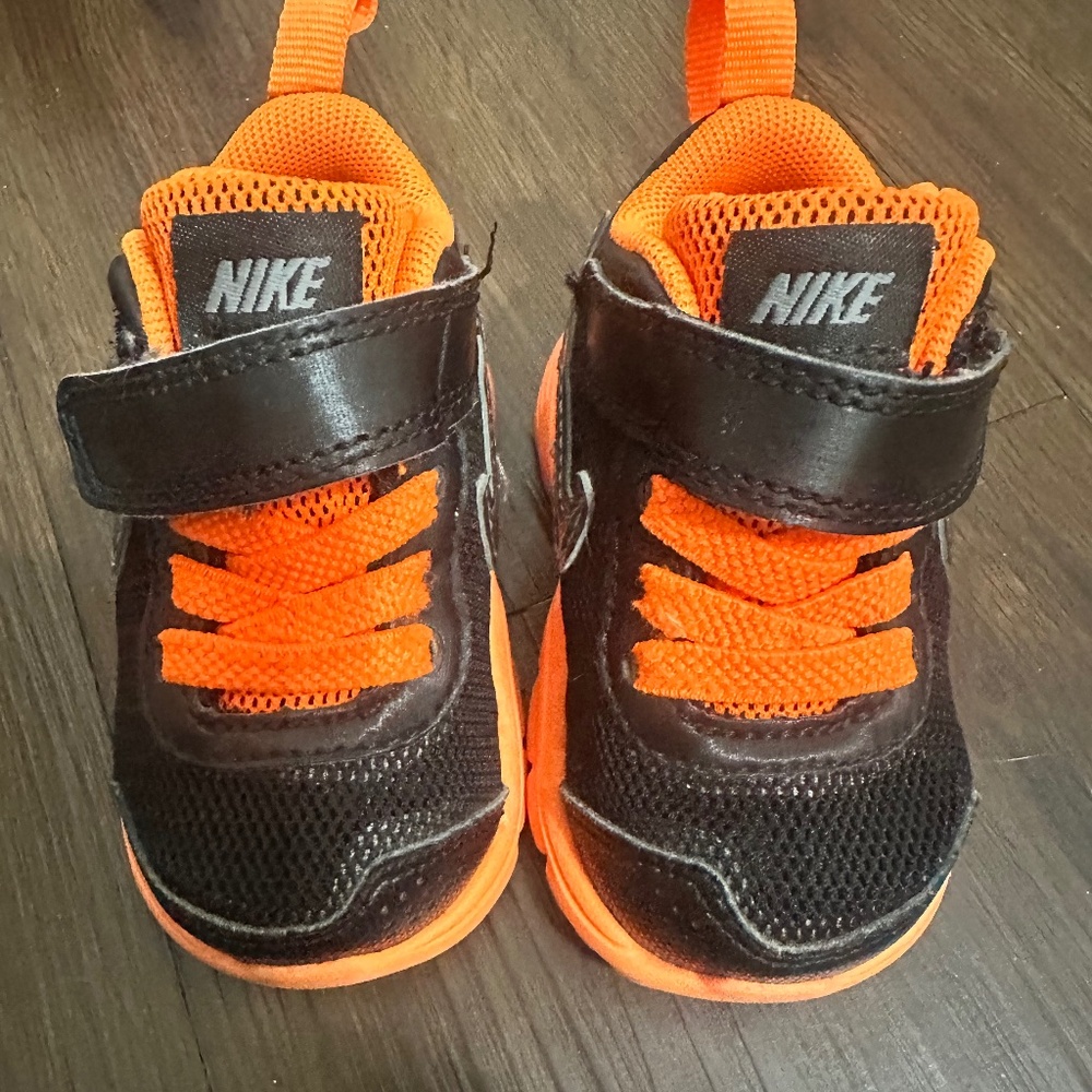 Toddler Nike athletic shoes, 2C, orange and black